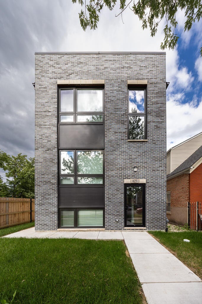 Brick Home with Blue Smooth Ironspot