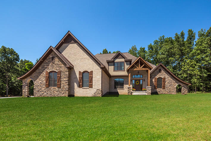 Brick & Stone Home with Anchor Bay & Buckingham Ledgestone