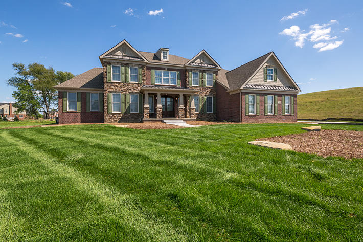 Brick & Stone Home with Tudor Williamsburg & Buckingham Ledgestone